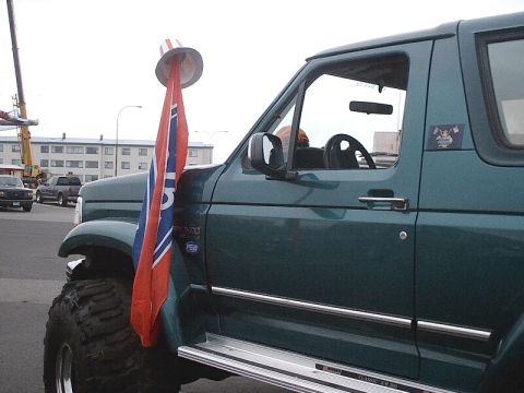 1996 Ford Bronco - This 1996 Ford Bronco is seen with a patriotic hat and flag attached to its antenna.