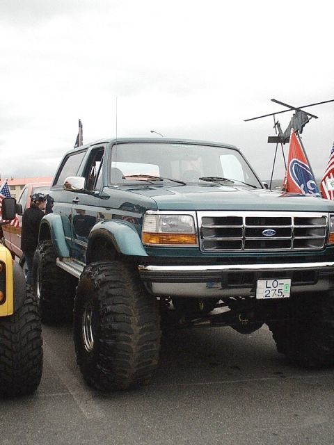 1996 Ford Bronco - This lifted 1996 Ford Bronco features massive off-road tires and a prominent grille.