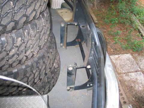 1995 Ford Bronco - Spare tires and roll cage mounts are visible in this close-up view.