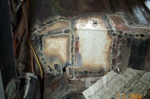 1986 Ford Bronco - Passenger side almost done. Notice the nut I welded on top so that I could hook the ground for the welder.