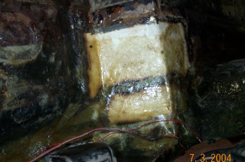 1986 Ford Bronco - Drivers side after patches welded in and covered with fiberglass and resin.