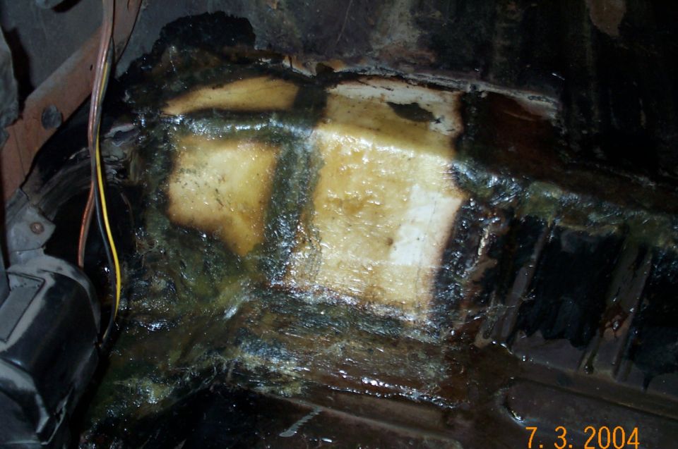 Passenger side after welded patched are covered with fiberglass and resin.