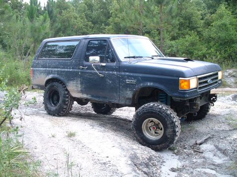 1995 Ford Bronco - This lifted 1995 Ford Bronco is equipped with large off-road tires, ready for terrain.