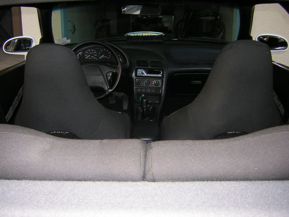 1995 Ford Probe interior showing front seats, dashboard, steering wheel, and center console