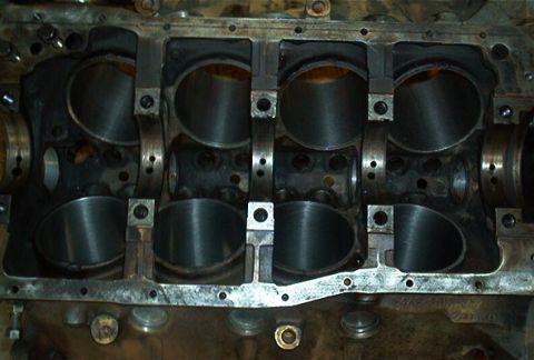 1986 Ford Bronco - Close-up view of engine block cylinders, the SuperMotors logo at the bottom right.