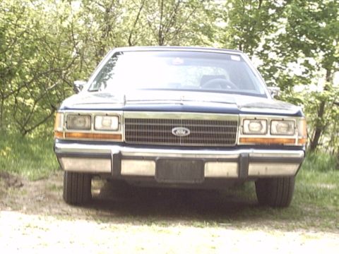 1990 Ford Crown Victoria LTD - Front view of a 1990 Ford Crown Victoria LTD parked outdoors.