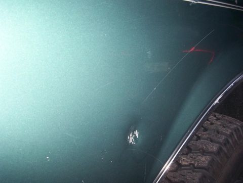 1989 Ford Bronco - dent behind wheel well