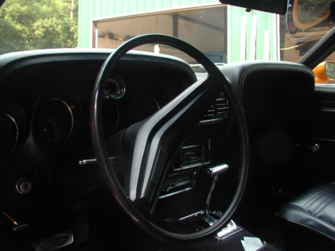 1988 Ford Bronco - Interior view of a classic car, showing the steering wheel, dashboard, and shifter.