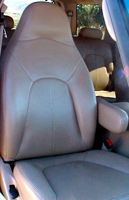 1997 Ford Expedition - Interior view of tan leather seats, with a watermark for "SUPERMOTORS" visible at the bottom.
