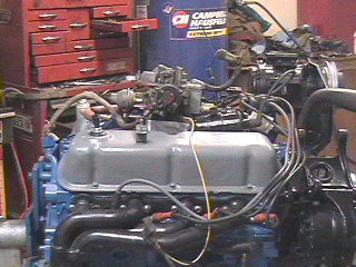1982 Ford Bronco - Close-up view of an engine assembly with visible text from SuperMotors.net.
