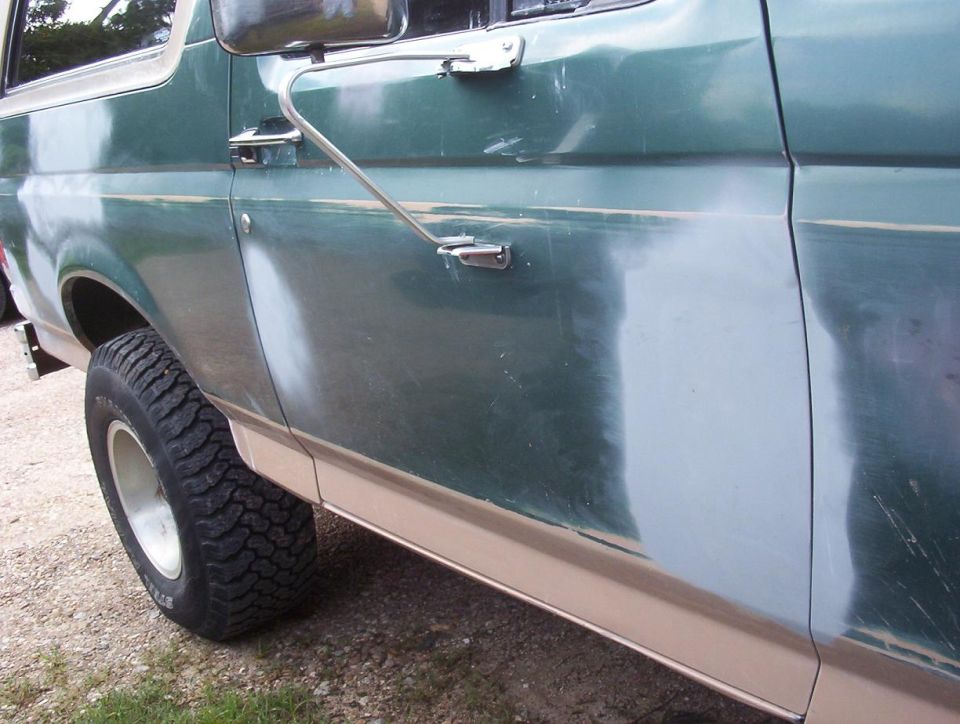 1989 Ford Bronco side panel showing primer and sanding marks before paint