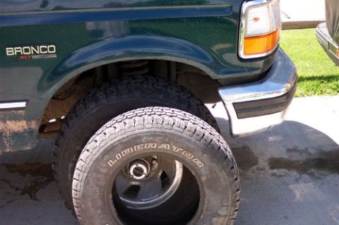 1995 Ford Bronco - old Liberator 235s next to the mounted 33s