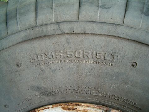 1991 Ford Bronco - Close-up of tire sidewall markings indicating size and rim specifications.