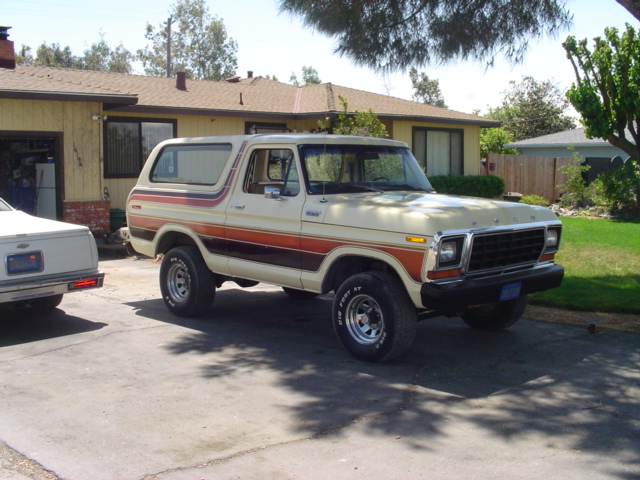 1978 Ford Bronco with woodgrain side trim parked in driveway