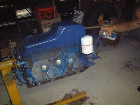 1967 Ford Galaxie - Engine block and oil filter being worked on in a garage setting.