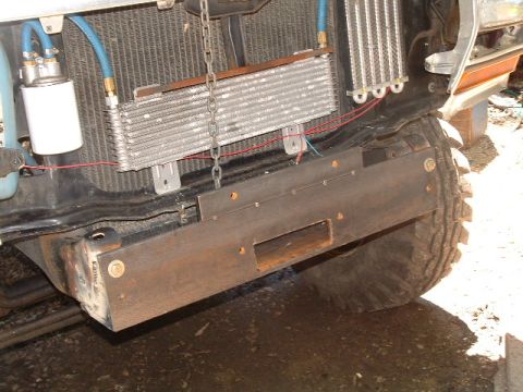 1979 Ford Bronco - Front view of a 1979 Ford Bronco showing the radiator, oil cooler, and custom bumper.