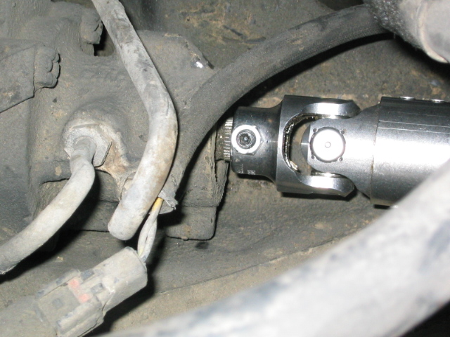 New steering shaft U-joint with pinch bolt installed near firewall