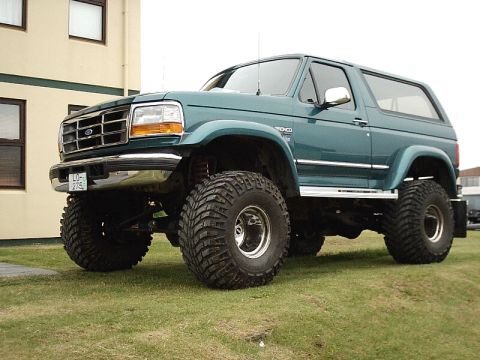 1996 Ford Bronco - This lifted 1996 Ford Bronco features aggressive off-road tires and a prominent grille.