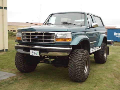 1996 Ford Bronco - Modified 1996 Ford Bronco with significant suspension lift and aggressive tires.