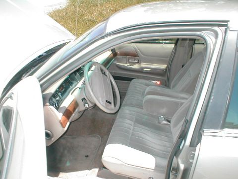 1994 Ford Crown Victoria - Interior view of a 1994 Ford Crown Victoria, cloth seats and wood trim accents.