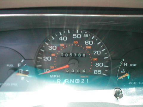 1994 Ford Crown Victoria - Dashboard gauges including speedometer, odometer, fuel, and temperature readings.