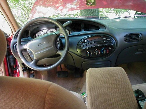 1997 Ford Taurus interior with dashboard, steering wheel, and radio