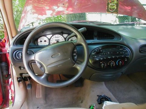 1997 Ford Taurus - Interior view of a 1997 Ford Taurus, highlighting the dashboard and controls.