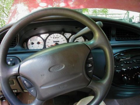 1997 Ford Taurus - The interior of a 1997 Ford Taurus shows the dashboard, steering wheel, and instrument cluster.