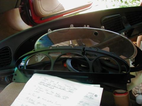 1997 Ford Taurus - Instrument cluster removed from a car, with handwritten notes detailing measurements.