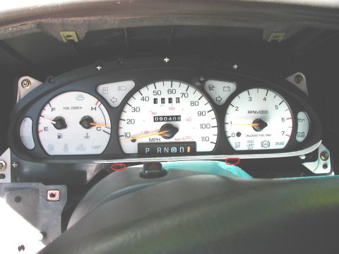 1997 Ford Taurus - The vehicle's instrument cluster is shown with the dashboard removed, revealing the gauges and indicators.
