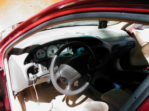 1997 Ford Taurus - Interior view of a 1997 Ford Taurus, focusing on the dashboard and steering wheel.