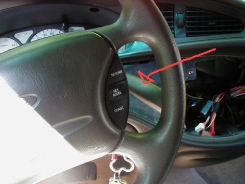 1997 Ford Taurus - Interior view of a 1997 Ford Taurus, showing the steering wheel, instrument cluster, and exposed wiring behind the dashboard.