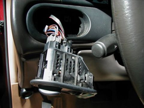 1997 Ford Taurus - Dashboard component removed, exposing wiring for radio and instrument cluster access in a 1997 Ford Taurus.