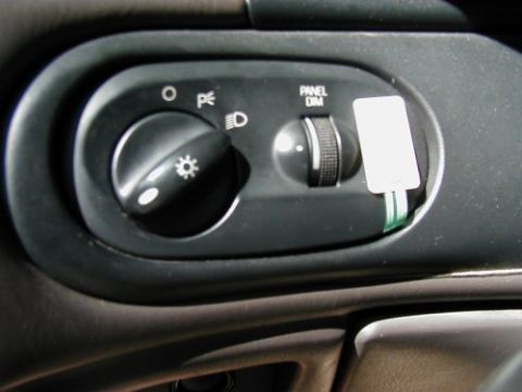 1997 Ford Taurus - Interior view of a vehicle's headlight and dimmer control panel.