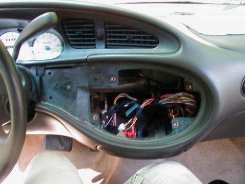 1997 Ford Taurus - The center console of a 1997 Ford Taurus is open, revealing the wiring harness behind the dash.