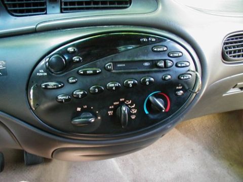 1997 Ford Taurus - Interior view of a 1997 Ford Taurus dashboard, showing the radio and climate control panel.