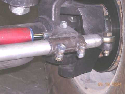 1994 Ford Bronco - This image shows a close-up view of a steering stabilizer and tie rod assembly, with a visible date stamp of May 19, 2004.