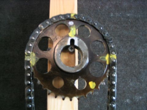 1986 Ford F-150 - Close-up of a timing chain and gear, likely an engine component.