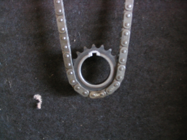 Timing chain and sprocket on dark background