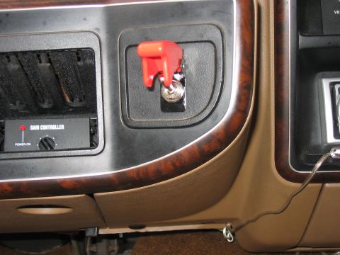 1988 Ford Bronco - This dashboard shot features an aftermarket gain controller and a prominent red toggle switch.
