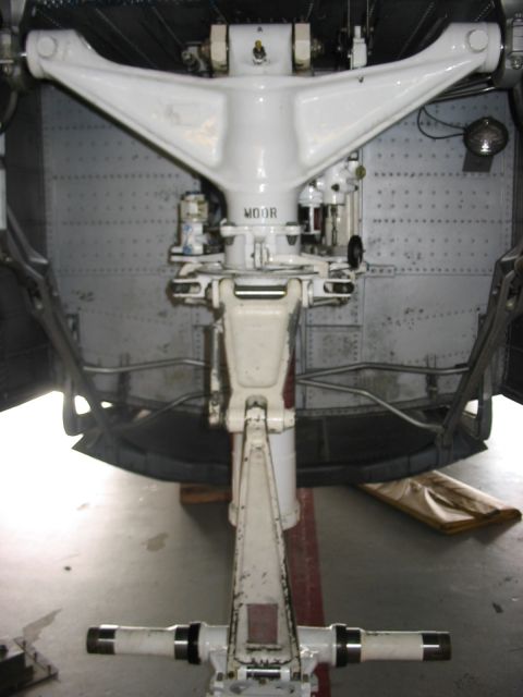 1988 Ford Bronco - Underside view of an aircraft's landing gear assembly, showing complex mechanical components and structural elements.