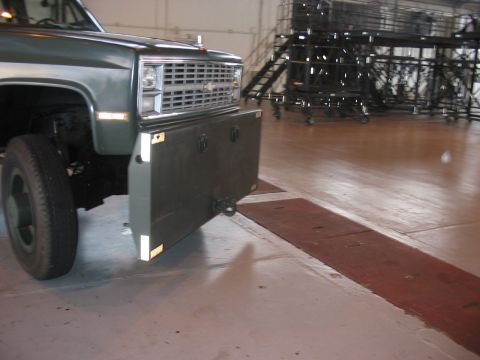 1988 Ford Bronco - The front of a truck is shown with a custom bumper that extends outward, obscuring the original grille.