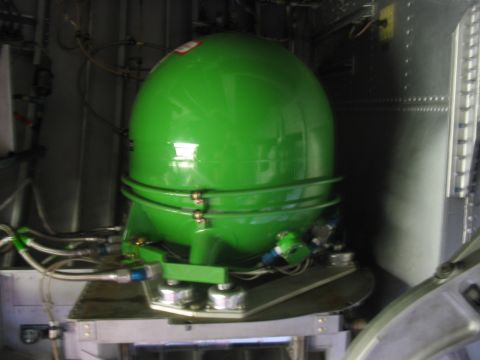 1988 Ford Bronco - A green spherical tank with attached hoses is visible within a metallic structure.