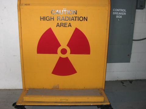 1988 Ford Bronco - A sign warns of a high radiation area, with a control breaker box visible nearby.