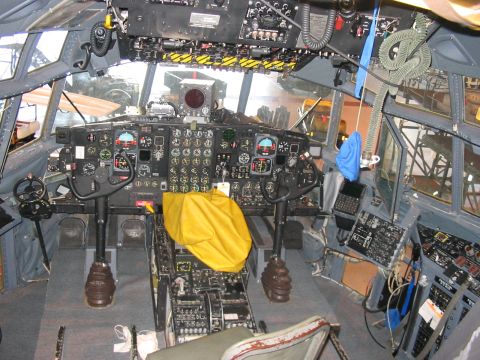 1988 Ford Bronco - The complex cockpit of an aircraft, dual control yokes and a vast array of instruments and switches.