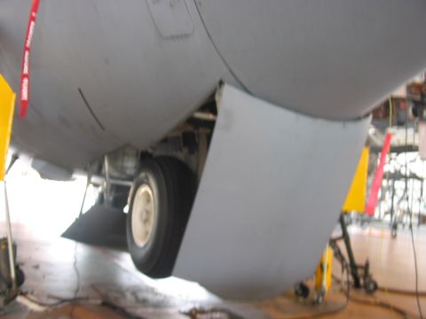 1988 Ford Bronco - The underside of an aircraft reveals its landing gear and a single wheel, with warning tags attached.