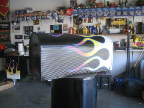 1981 Ford Bronco - A custom mailbox with flame graphics is displayed in a garage setting.