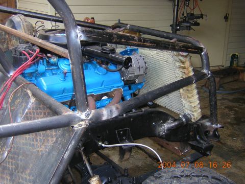 1984 Chevrolet Blazer - Custom off-road vehicle chassis with blue engine and roll cage, dated 2004.