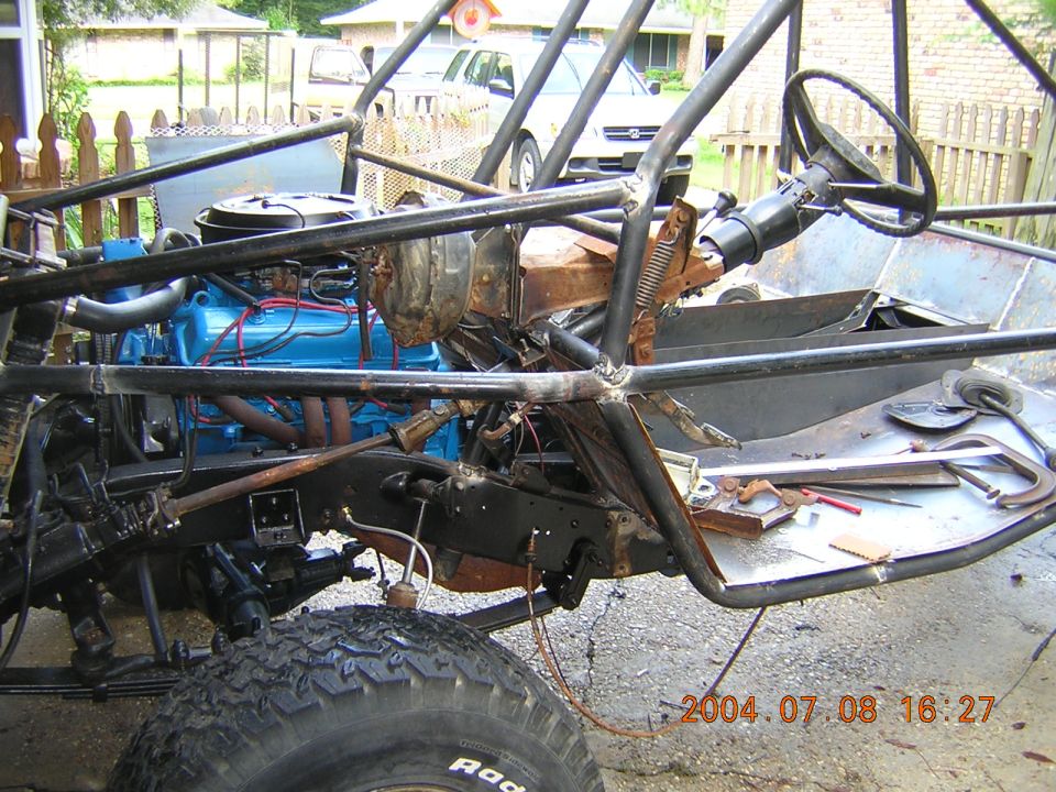 Custom buggy interior with blue engine and roll cage