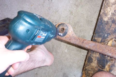 1968 Ford F-100 - Step 1--drill out as much rubber as possible without damaging the outer sleeve since it will be reused.